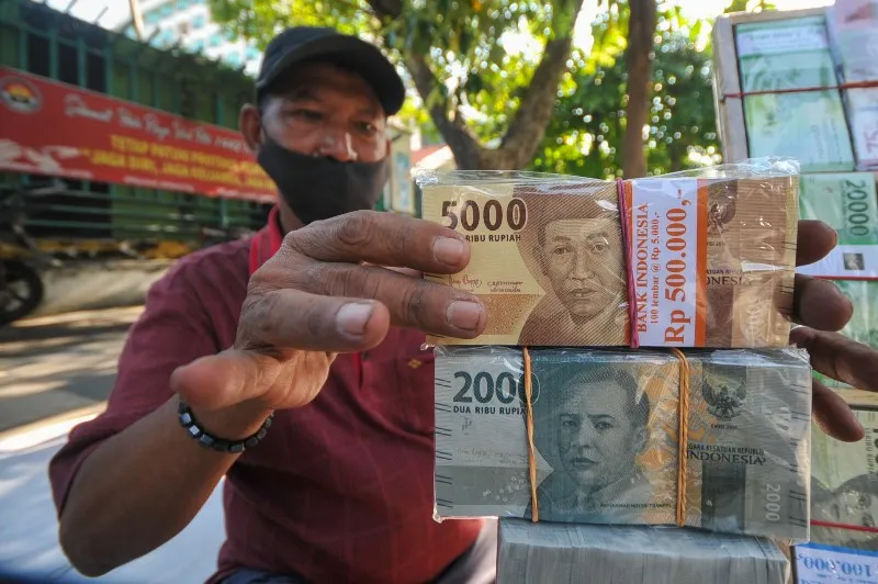 FOTO: Penjual Jasa Penukaran Uang