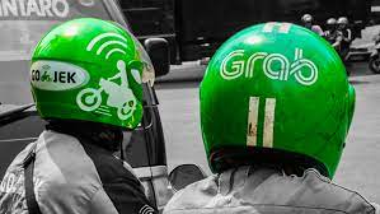 Ilustrasi Grab dan Gojek (Foto: Nikkei Asia)