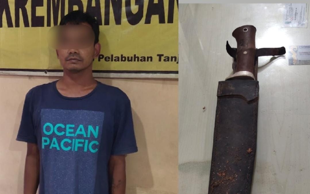 Falin, pelaku penganiayaan terhadap tetangganya sendiri saat diamankan di Mapolsek Krembangan, Surabaya.
