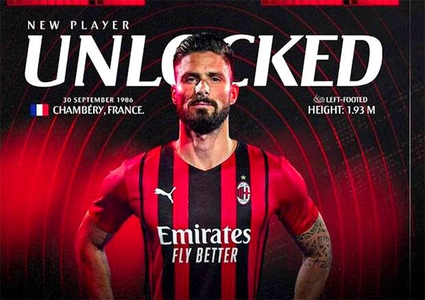 Olivier Giroud mengenakan seragam AC Milan.